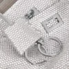 Bolso bandolera tipo Rodeo para mujer con pedrería en gris humo