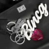 Bolso de mano Rodeo para mujer, pequeño, con dijes, en negro Bolso de mano Rodeo para mujer, pequeño, con dijes, en negro