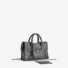 Bolso Le City pequeño en roca volcánica