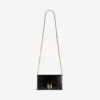 Cartera de mujer con forma de Hourglass y cadena, en color negro Cartera de mujer con forma de Hourglass y cadena, en color negro