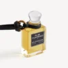 Colgante con frasco de perfume en miniatura en color negro