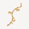 Llavero para mujer con dijes en dorado Llavero para mujer con dijes en dorado