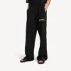 Pantalones de chándal holgados para hombre con diseño de spray desordenado en negro