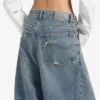 Pantalones de mezclilla holgados de tiro bajo para mujer en azul vintage desgastado Pantalones de mezclilla holgados de tiro bajo para mujer en azul vintage desgastado