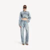 Pantalones de mezclilla para mujer con costuras retorcidas en azul claro decolorado