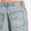 Pantalones de mezclilla para mujer con costuras retorcidas en azul claro decolorado