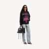 Sudadera con capucha y cremallera «Dream» para mujer en negro Sudadera con capucha y cremallera «Dream» para mujer en negro