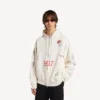 Sudadera con capucha y cremallera oversize para hombre con diseño de tatuaje en color crema Sudadera con capucha y cremallera oversize para hombre con diseño de tatuaje en color crema