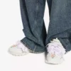 Zapatilla deportiva de mujer con moño en blanco/rosa Zapatilla deportiva de mujer con moño en blanco/rosa