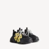 Zapatilla Triple S Tape Type para mujer en negro/amarillo Zapatilla Triple S Tape Type para mujer en negro/amarillo